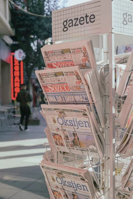 Close-up of a paper with branding, identity, design, strategy, and marketing concepts in orange and black.